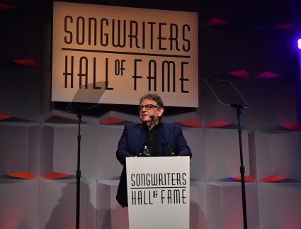 Sir Lucian Grainge presenting to Jody Gerson