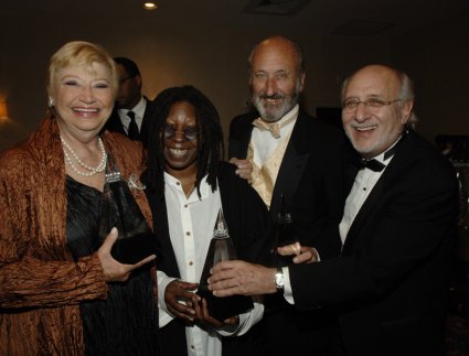 Mary Travers, Whoopi Goldberg, Peter Yarrow, and Paul Stookey