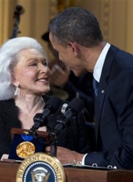 Eunice David accepting the award from President Obama