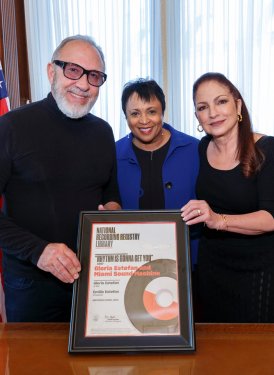 Dr. Carla Hayden, Librarian of Congress, presents Gloria and Emilio Estefan with their National Recording Registry certificate for their recording “Rhythm Is Gonna Get You”, which was inducted into the Registry last year. The Estefans were the honorees at last week’s Gershwin Prize event at Washington’s Constitution Hall.