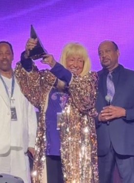 (left to right): Mark Webster, event co-producer; Prince’s sister and event executive producer, Sharon L. Nelson; presenter Gilbert Davison, former Prince manager and president of Paisley Park Enterprises